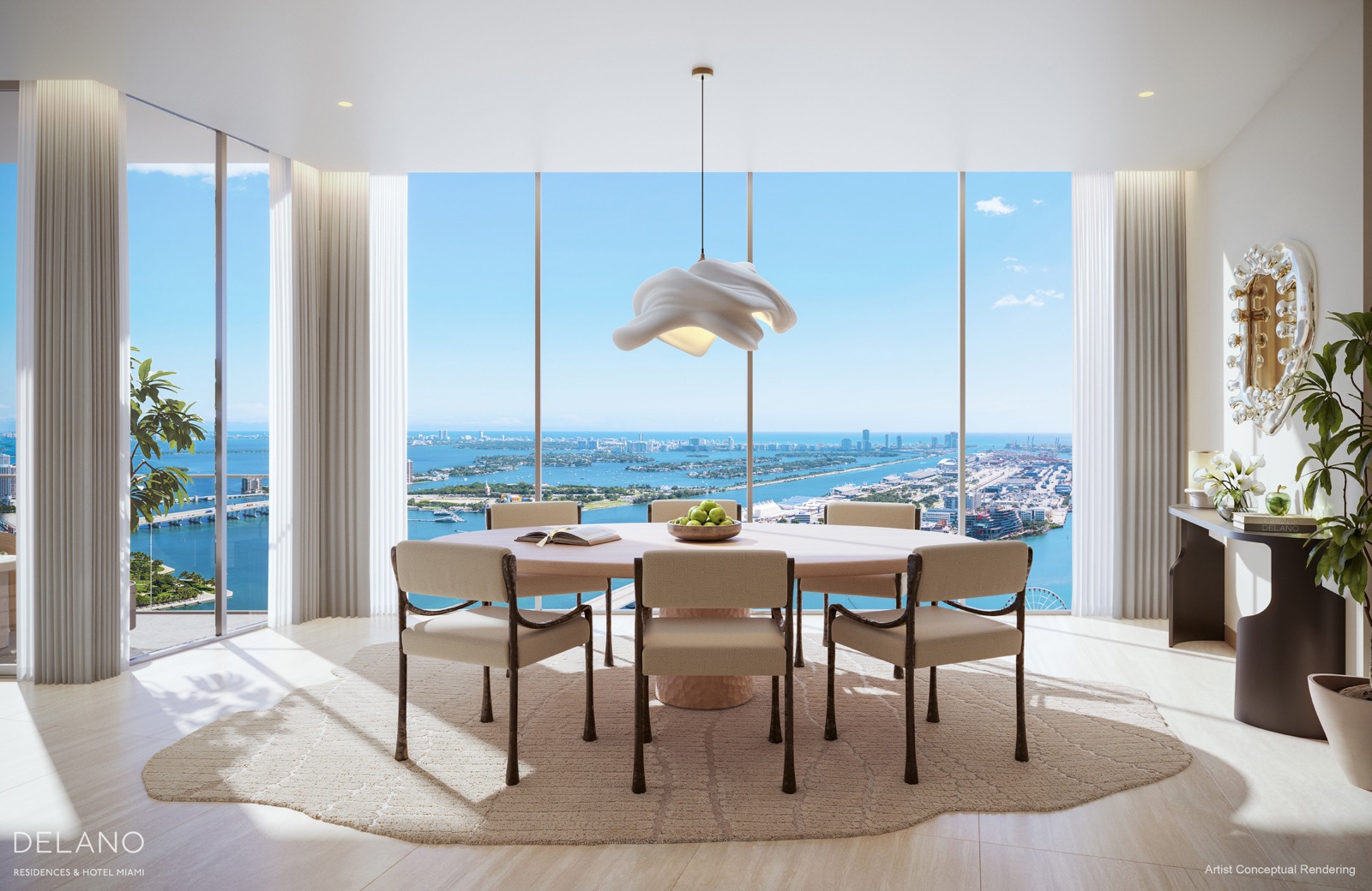 Residence dining room with floor-to-ceiling windows framing the skyline.